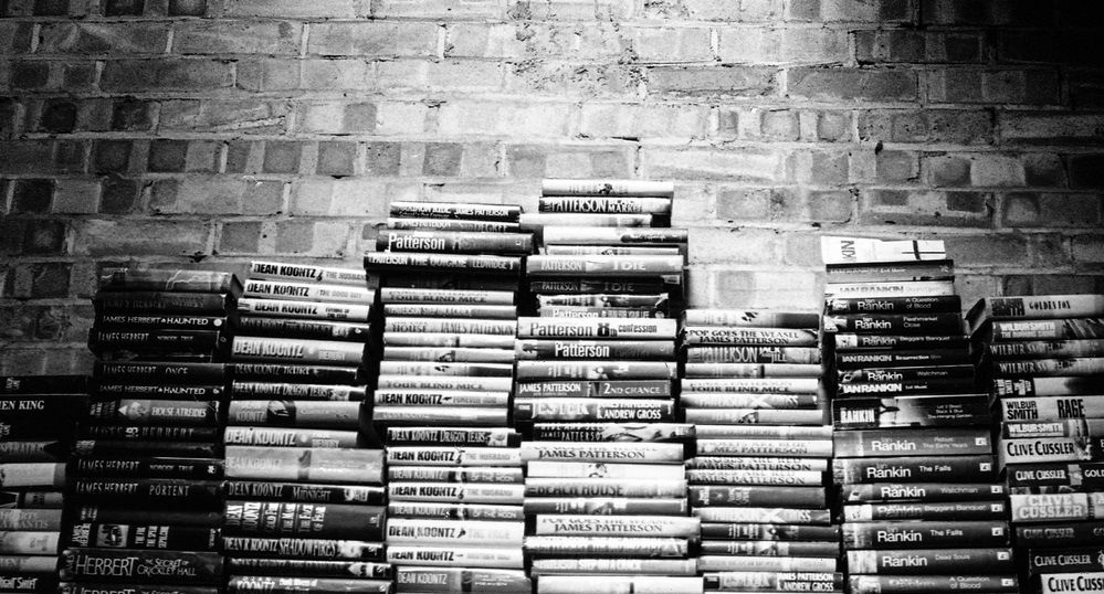 Books stacked against the wall
